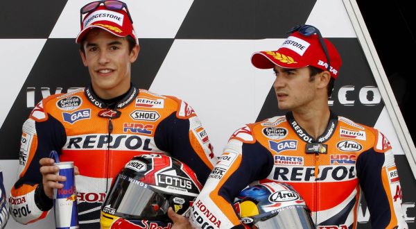 Yamaha MotoGP rider Lorenzo, Honda Moto GP rider Marquez and team mate Pedrosa pose after the qualifying session at Motorland race track in Alcaniz