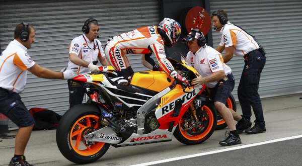 Honda MotoGP rider Pedrosa of Spain changes bikes during the Australian Motorcycle Grand Prix