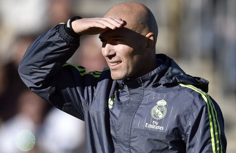 Real Madrid's new French coach Zinedine Zidane gestures during his first training session as coach of Real Madrid at the Alfredo di Stefano stadium in Valdebebas, on the outskirts of Madrid, on January 5, 2016. Real Madrid legend Zinedine Zidane promised to put his "heart and soul" into managing the Spanish giants after he was sensationally named as coach following Rafael Benitez's unceremonious sacking. AFP PHOTO/ GERARD JULIEN / AFP / GERARD JULIEN